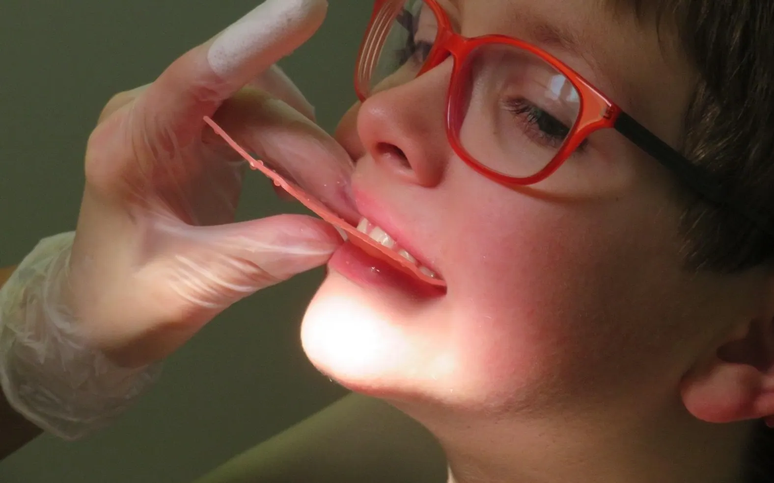 Child, dentist and denture