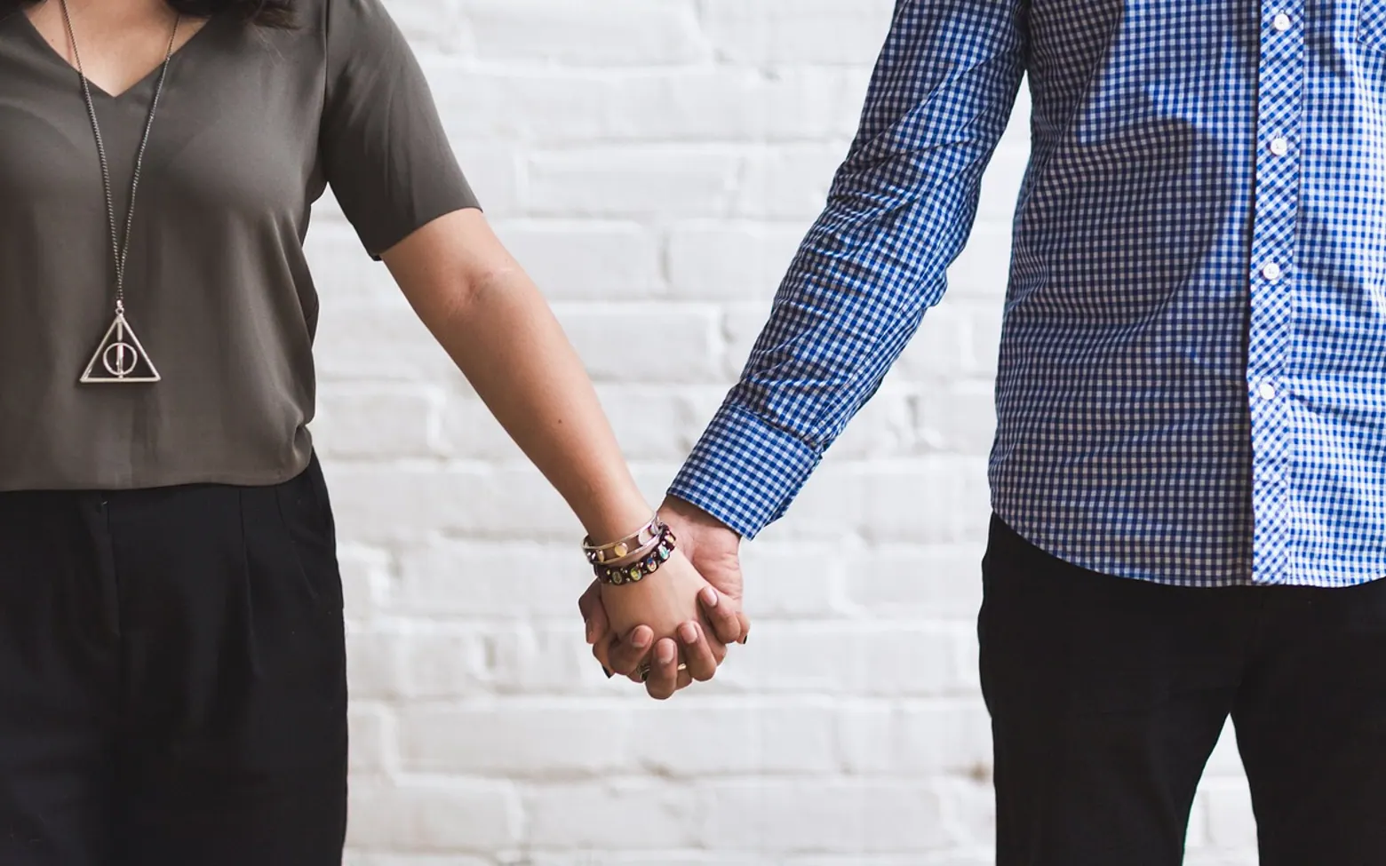 Couple, together and holding hands