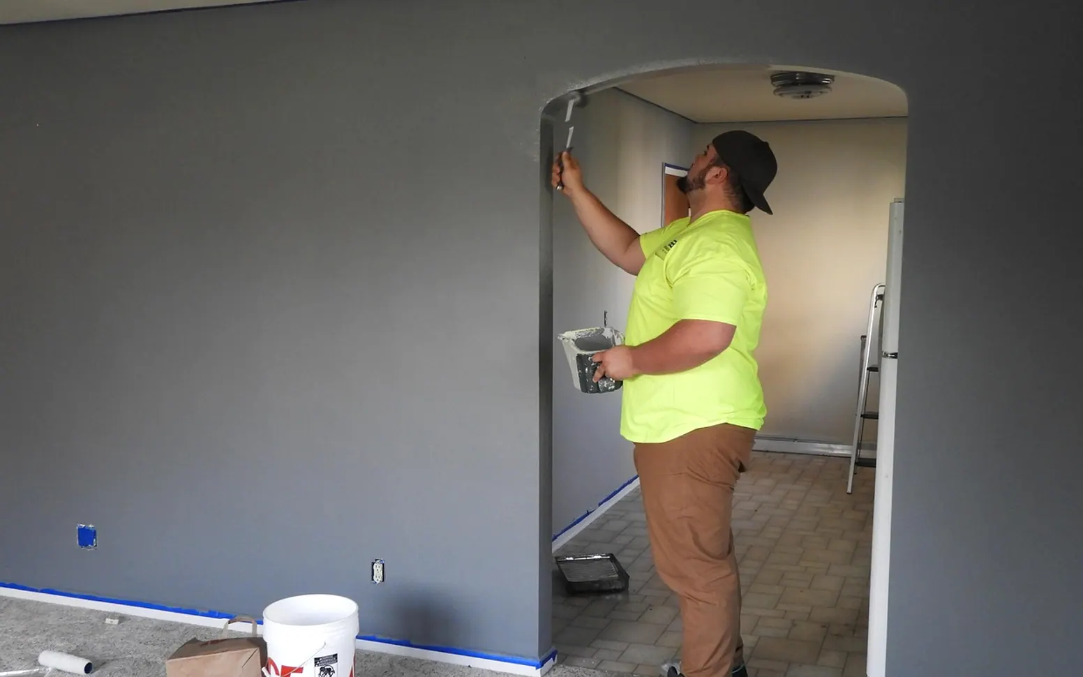 Painter, paint and house